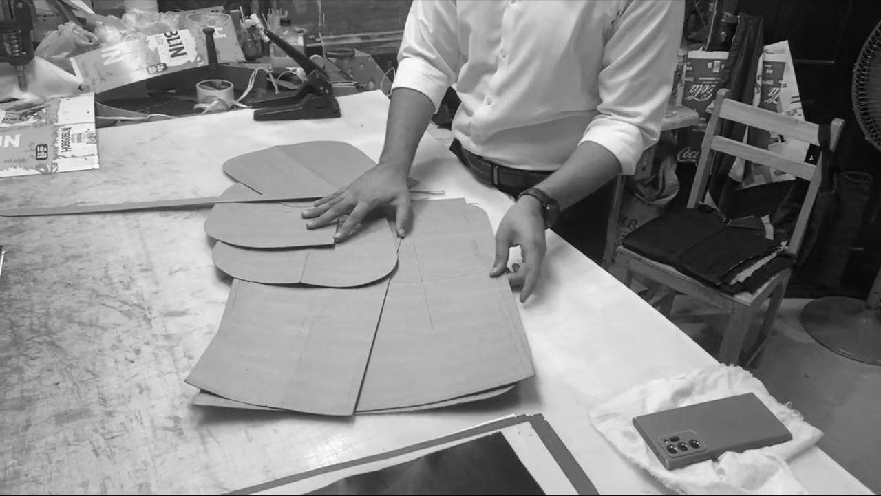 Pattern pieces laid out for leather bag production