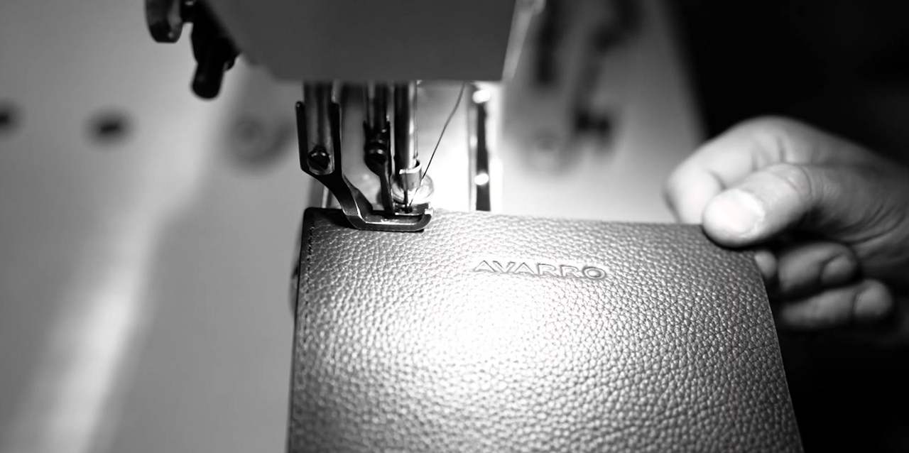 AVARRO logo embossed into leather on the sewing machine
